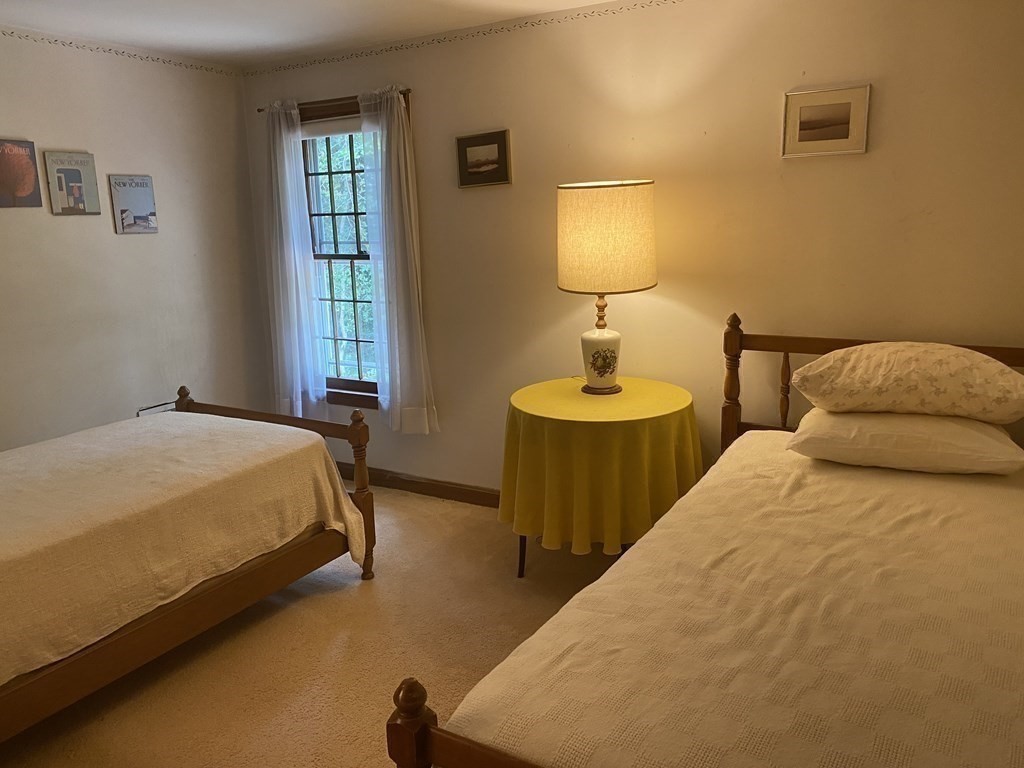 3 Beach Road Mattapoisett, MA 02739 - Photo 19 of 25 a bedroom with two beds and a lamp