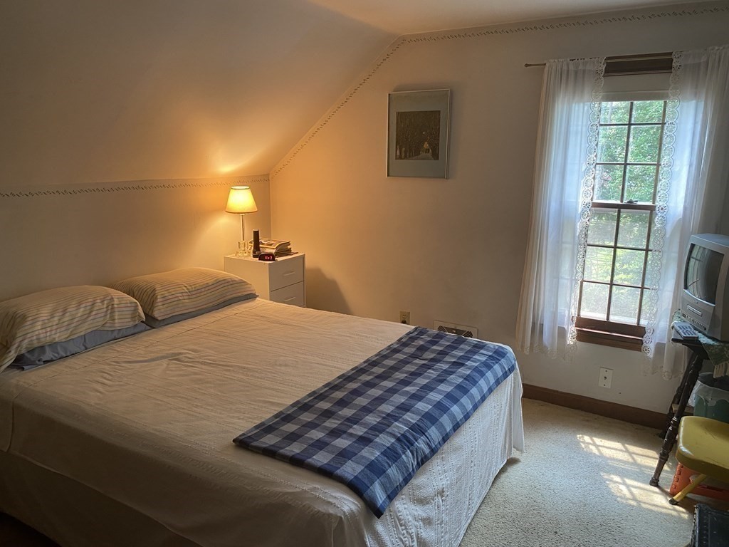 3 Beach Road Mattapoisett, MA 02739 - Photo 20 of 25 a bedroom with a bed and a window