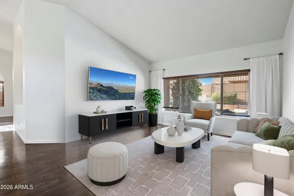 a living room with furniture and a large window