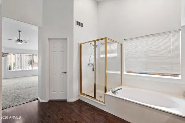 a bathroom with a bathtub and a shower