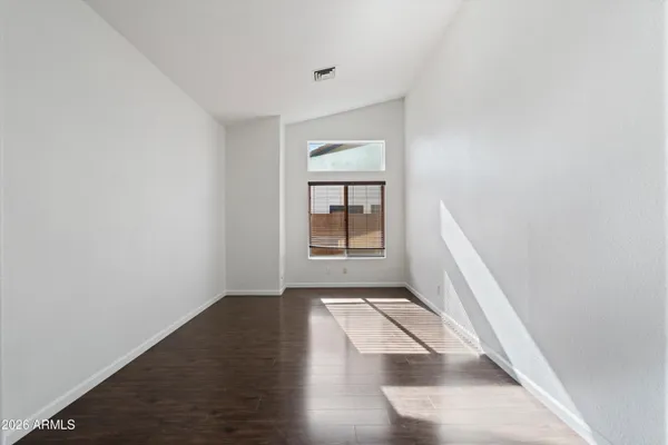 a view of wooden floor in an empty room