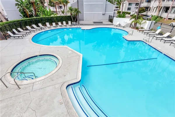 swimming pool view with a outdoor seating space