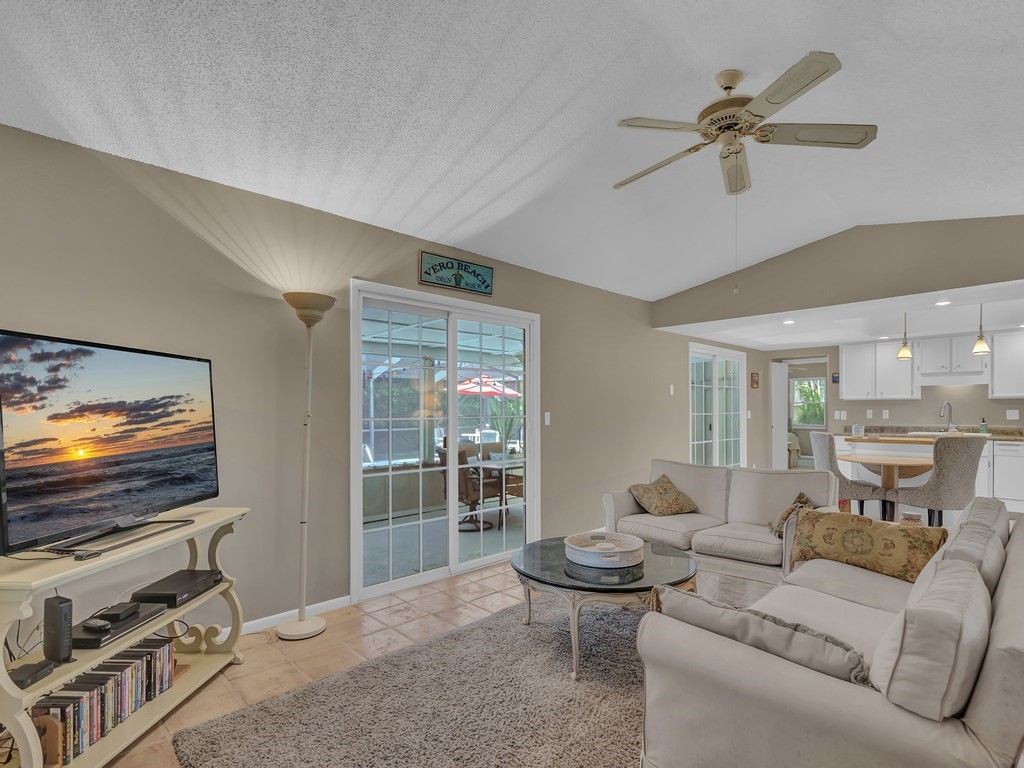 1045 Clipper Road Vero Beach, FL 32963 - Photo 13 of 36 a living room with furniture and a flat screen tv