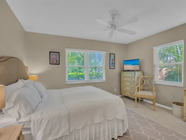 a bedroom with a bed and a chair