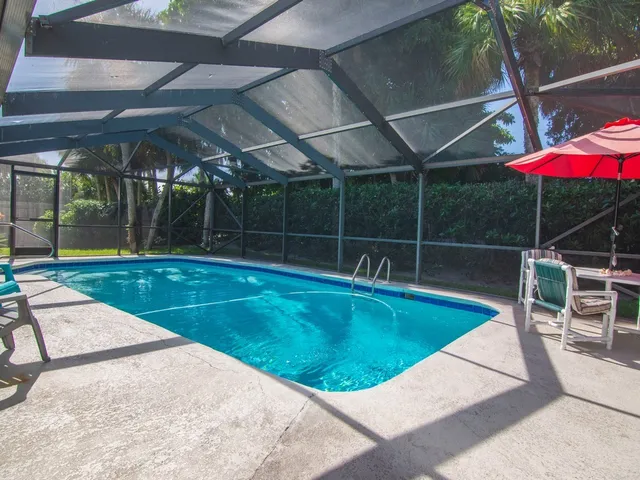 a view of a backyard with sitting area