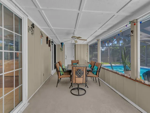 a dining room with furniture and windows