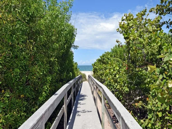 a view of balcony and yard