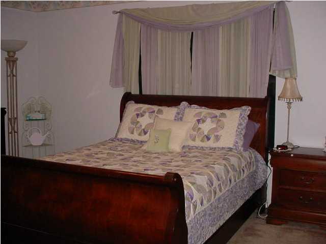 252 Ridge Lake Road Crestview, FL 32536 - Photo 3 of 4 a bedroom with a bed and with furniture