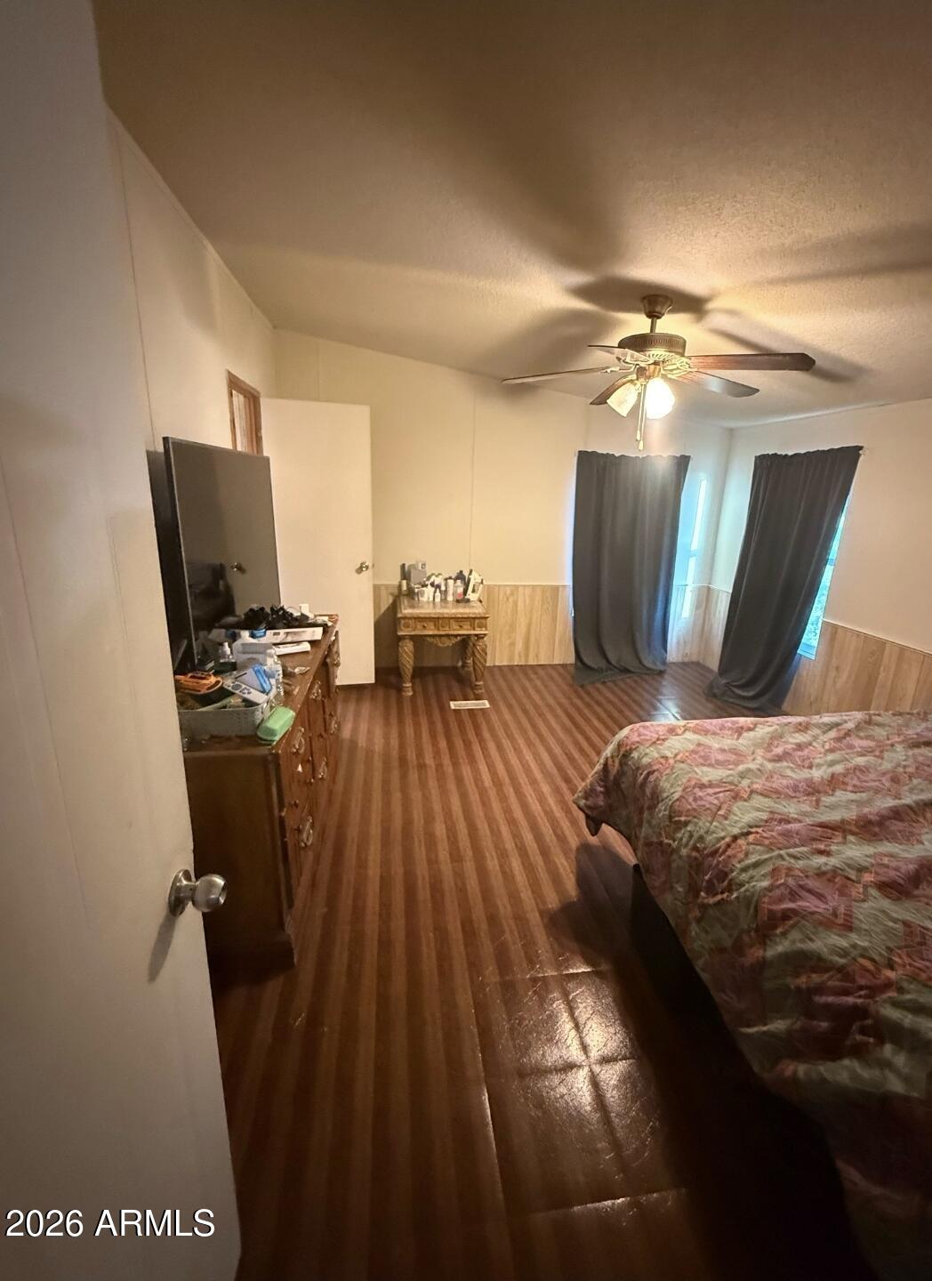 2625 Saddle Vista Road Tonopah, AZ 85354 - Photo 7 of 19 a bedroom with a bed and glass walk in closet