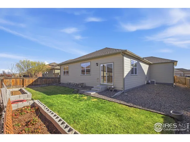 a view of a backyard with a garden