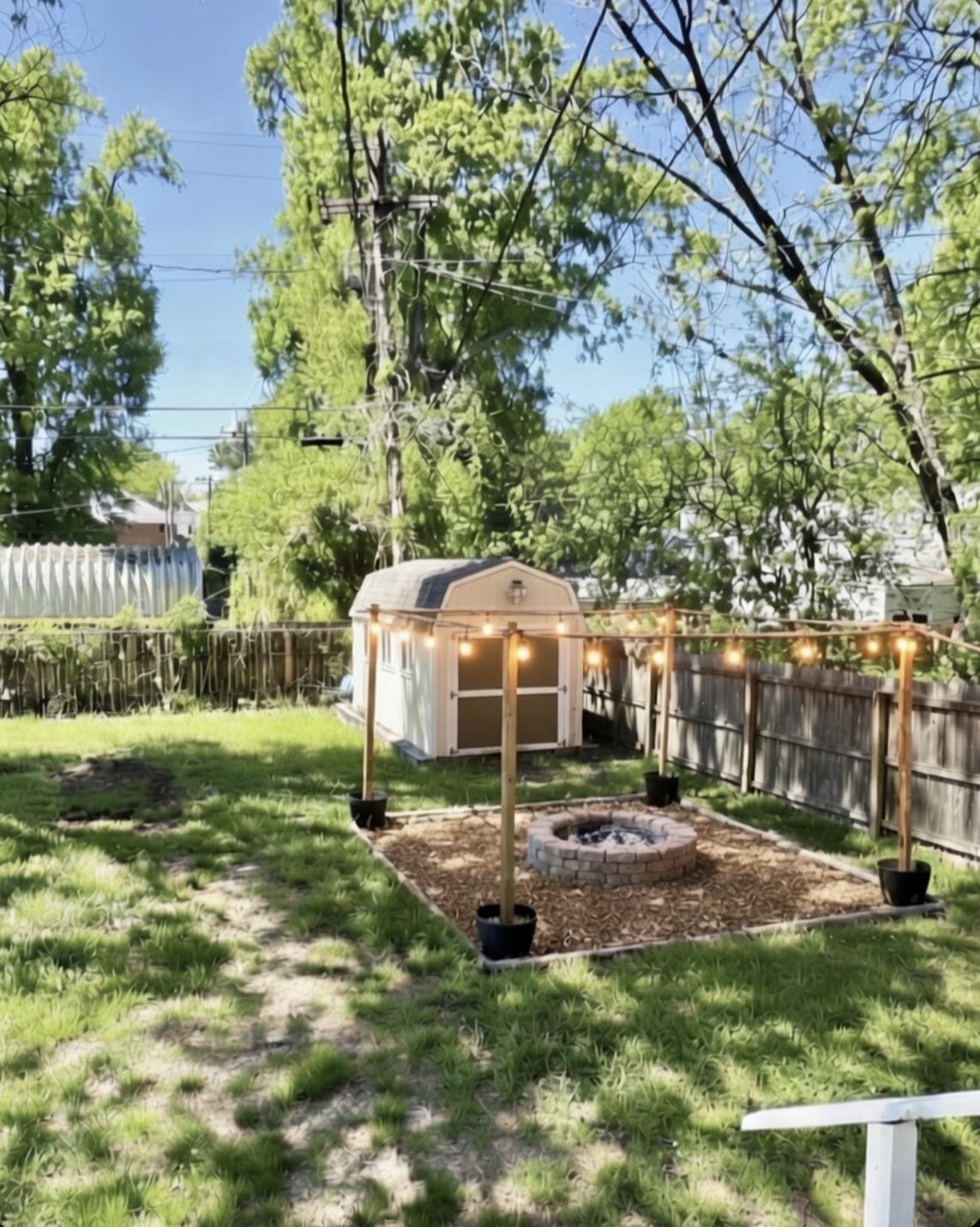 331 Alexander Street Memphis, TN 38111 - Photo 24 of 25 Fenced backyard with an outdoor fire pit and a storage shed