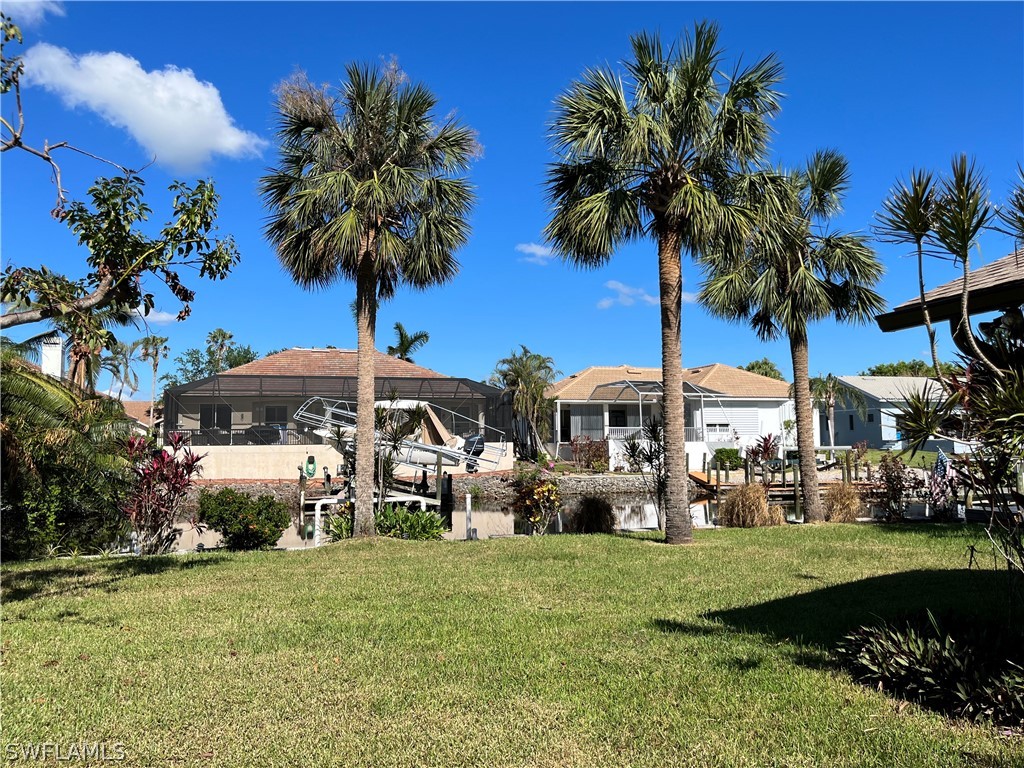 5650 Park Road Fort Myers, FL 33908 - Photo 12 of 15 a front view of multiple houses with yard