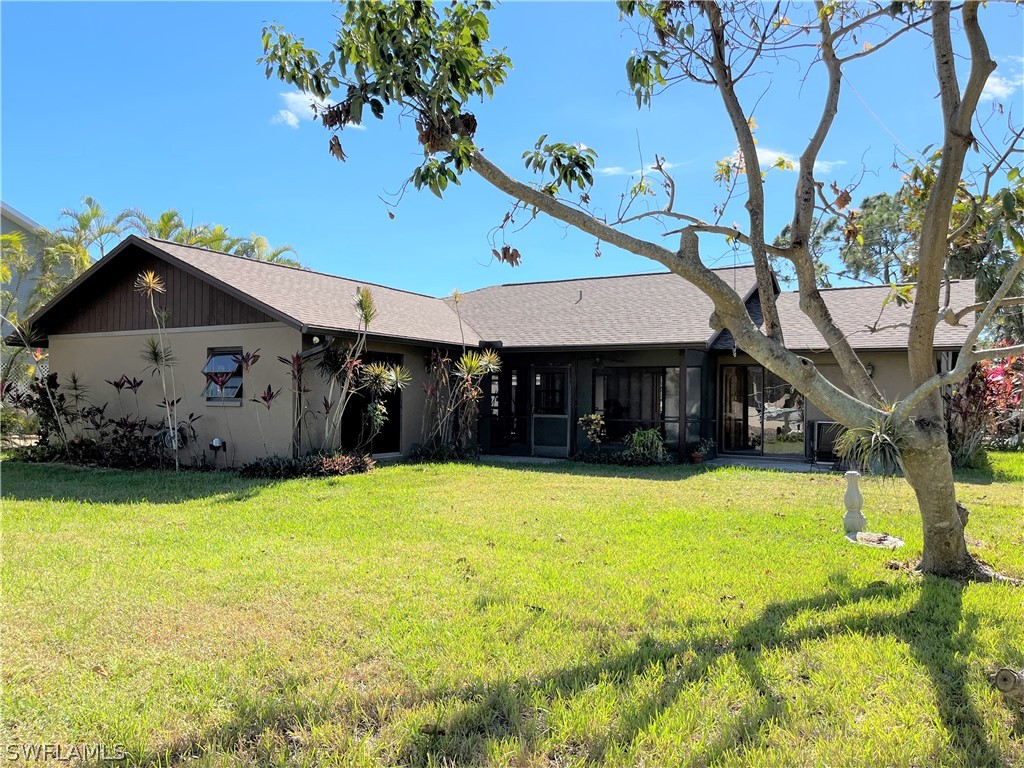 5650 Park Road Fort Myers, FL 33908 - Photo 10 of 15 a view of a house with pool and a yard