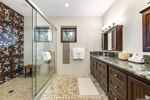 a bedroom with a bed and a chair