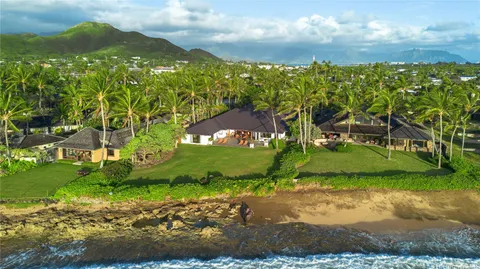 a front view of a house with yard patio and fire pit