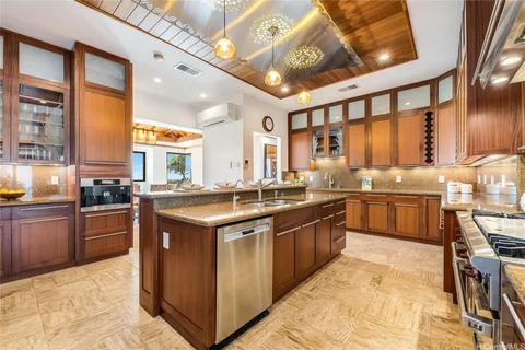 a kitchen with stainless steel appliances granite countertop a stove and a sink