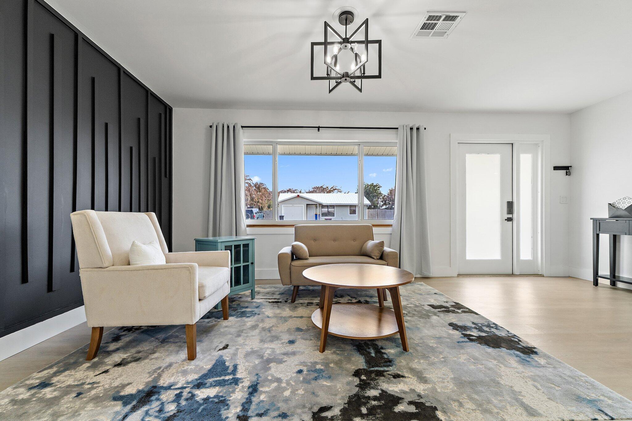 1851 Southeast Jackson Street Stuart, FL 34997 - Photo 11 of 61 a living room with furniture and a window