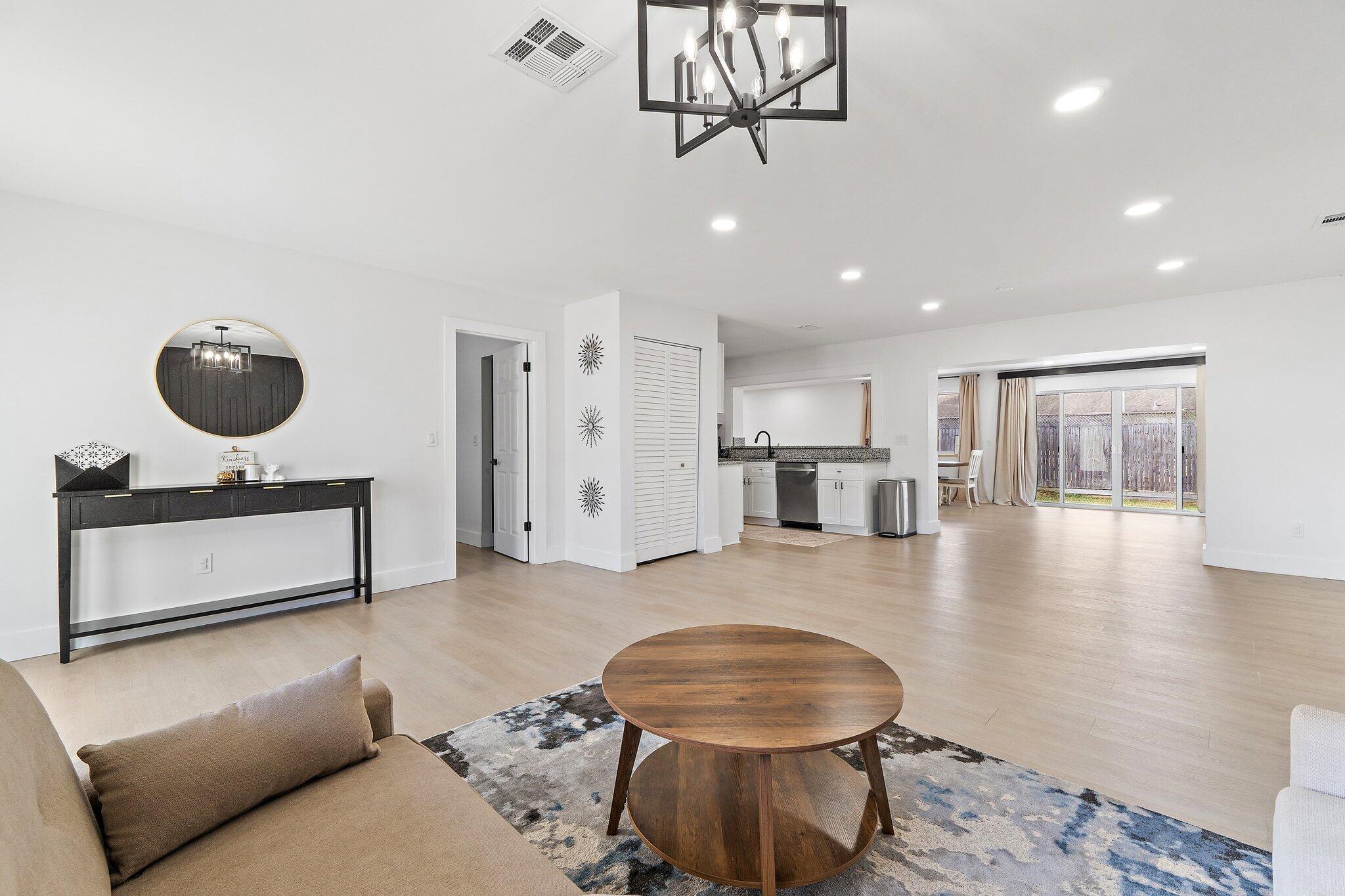 1851 Southeast Jackson Street Stuart, FL 34997 - Photo 13 of 61 a living room with furniture and a wooden floor