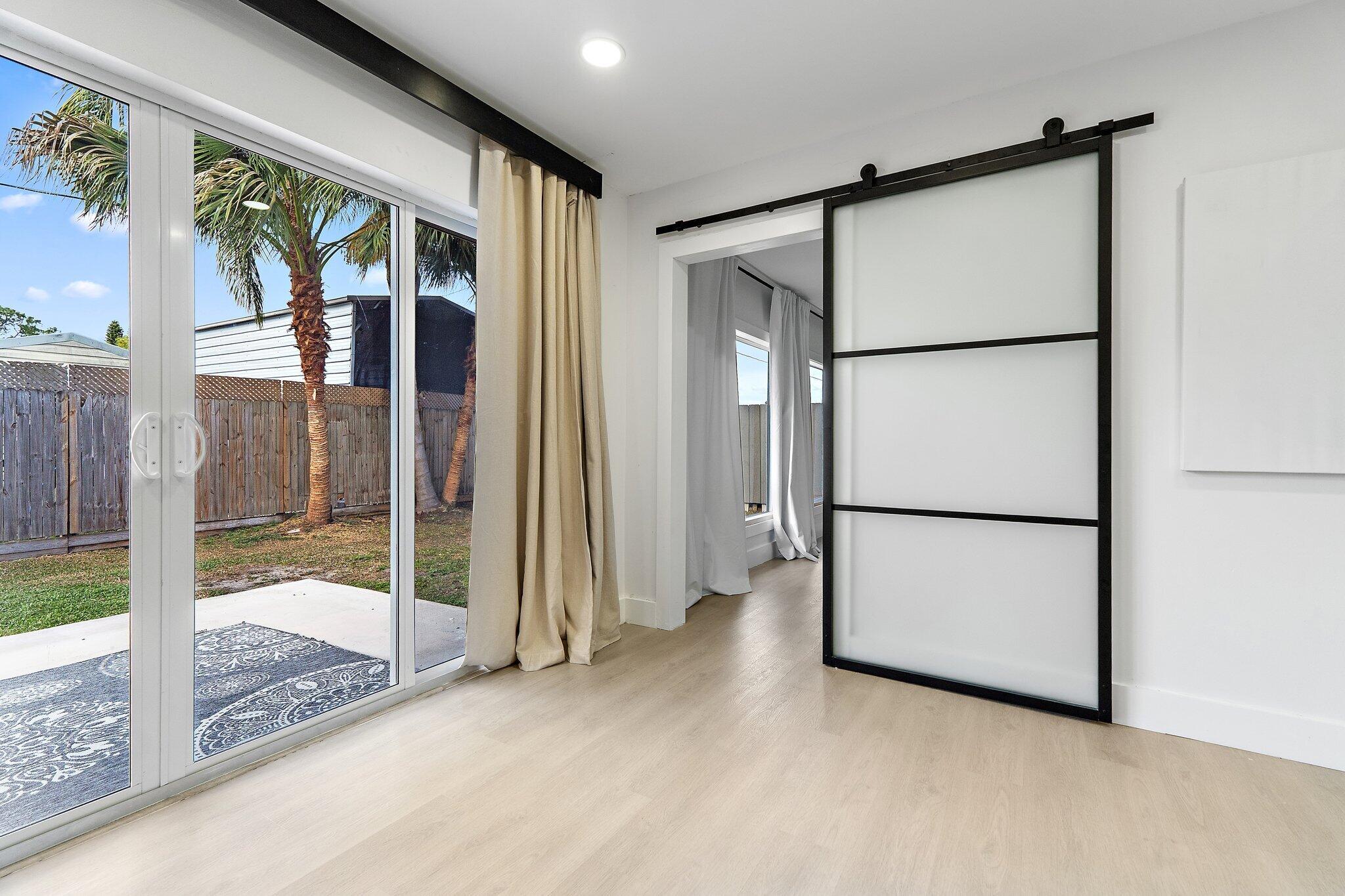 1851 Southeast Jackson Street Stuart, FL 34997 - Photo 19 of 61 a view of an empty room with a window