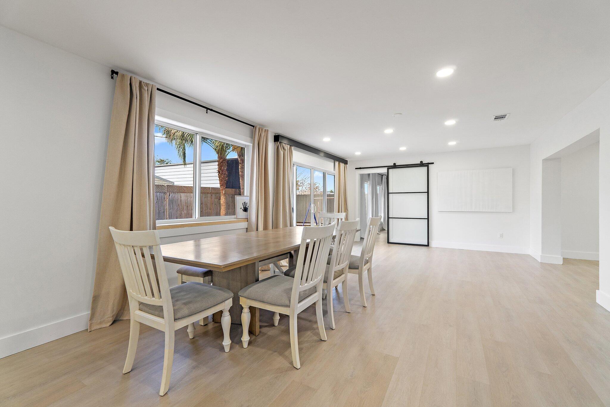 1851 Southeast Jackson Street Stuart, FL 34997 - Photo 20 of 61 a view of a dining room with furniture