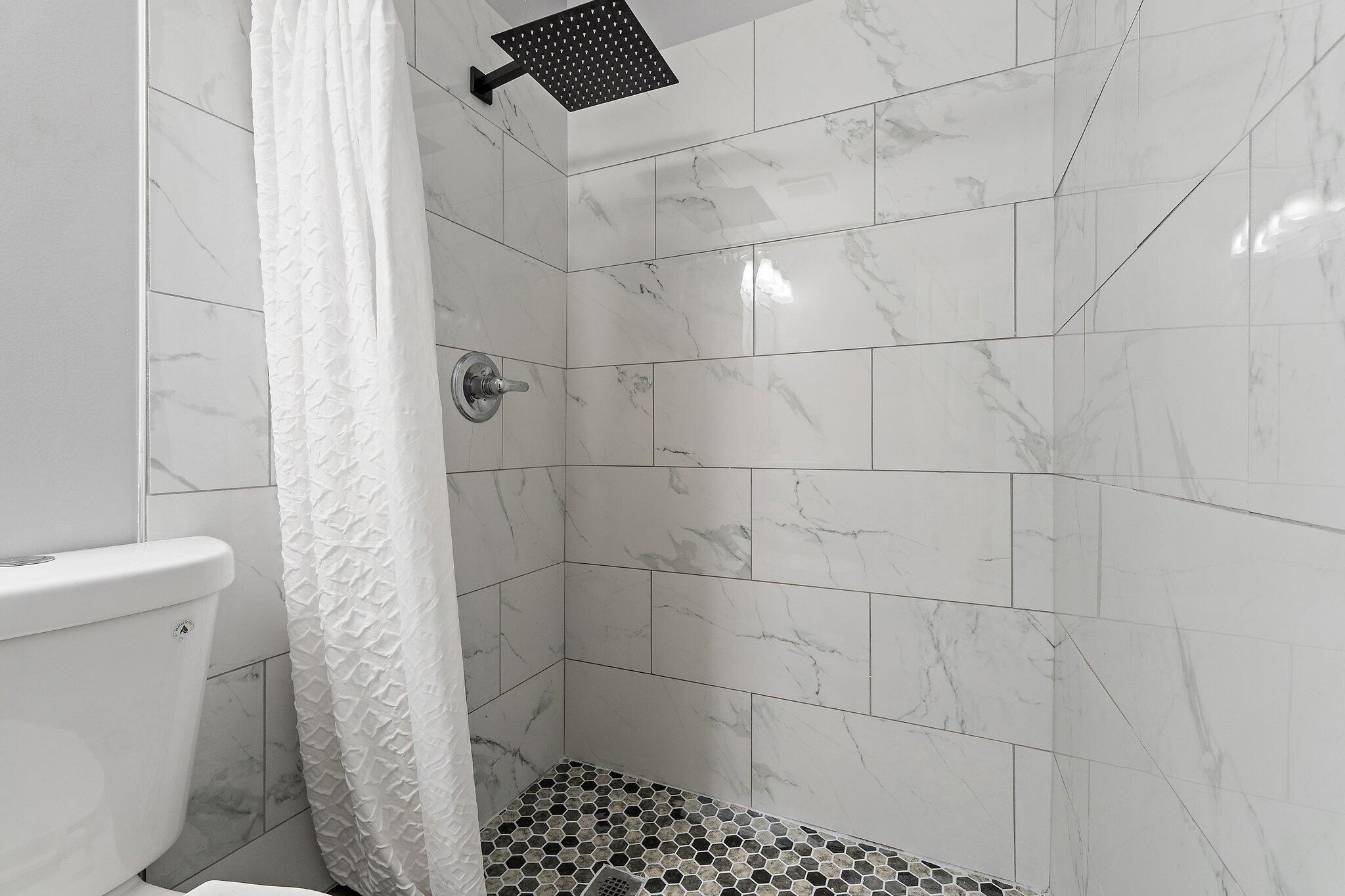 1851 Southeast Jackson Street Stuart, FL 34997 - Photo 43 of 61 a bathroom with a shower