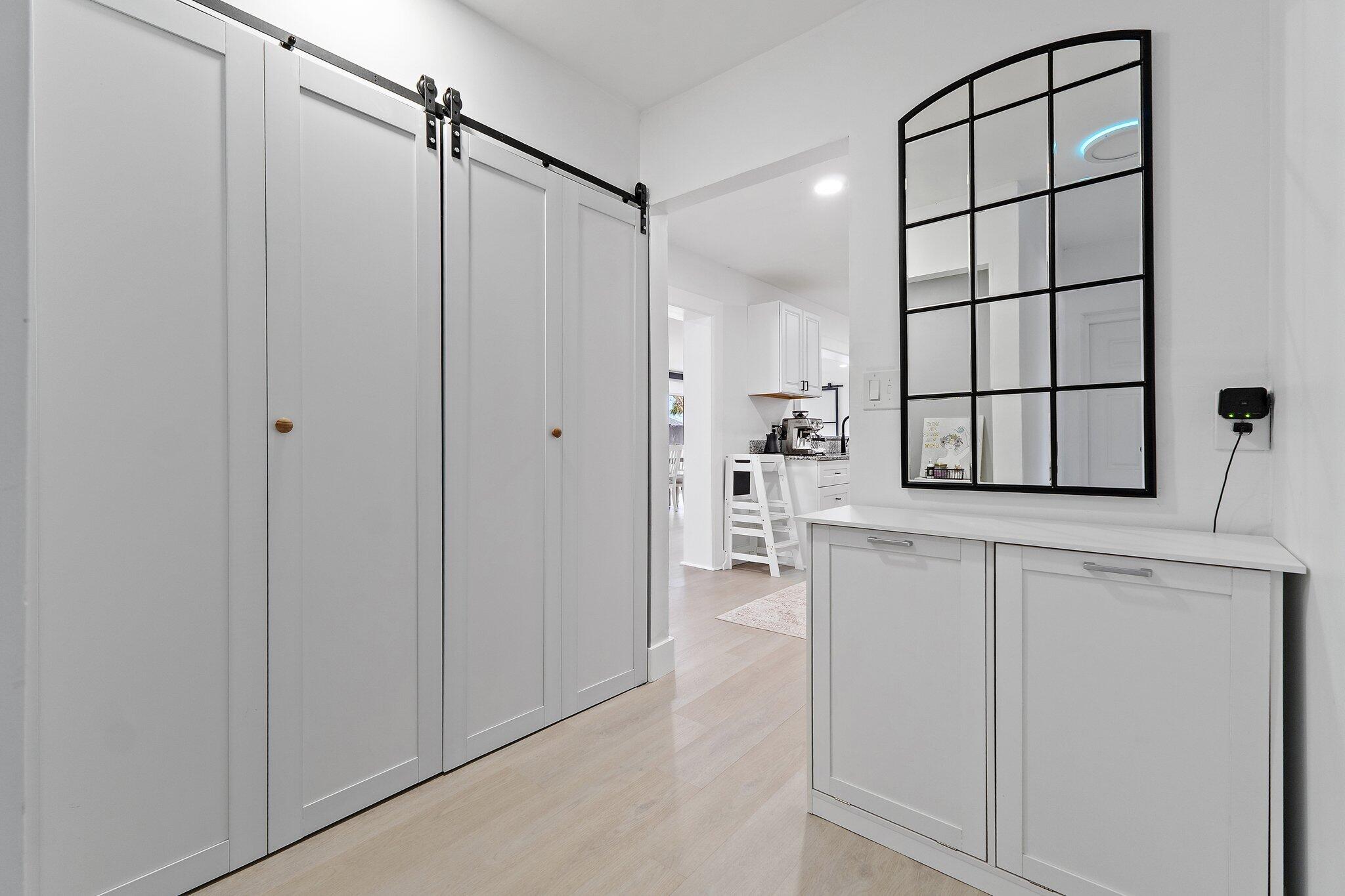 1851 Southeast Jackson Street Stuart, FL 34997 - Photo 44 of 61 a kitchen with white cabinets and white appliances