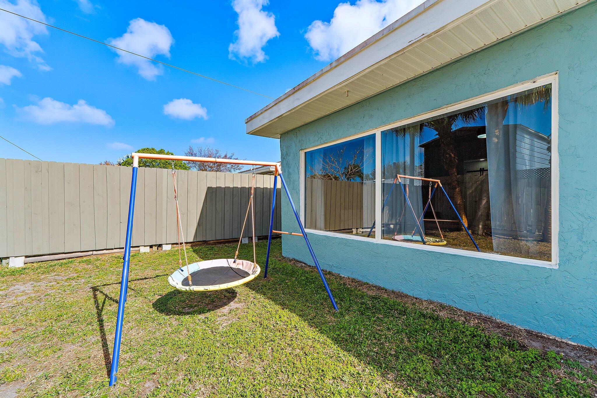 1851 Southeast Jackson Street Stuart, FL 34997 - Photo 54 of 61 a view of a backyard with a table and chair