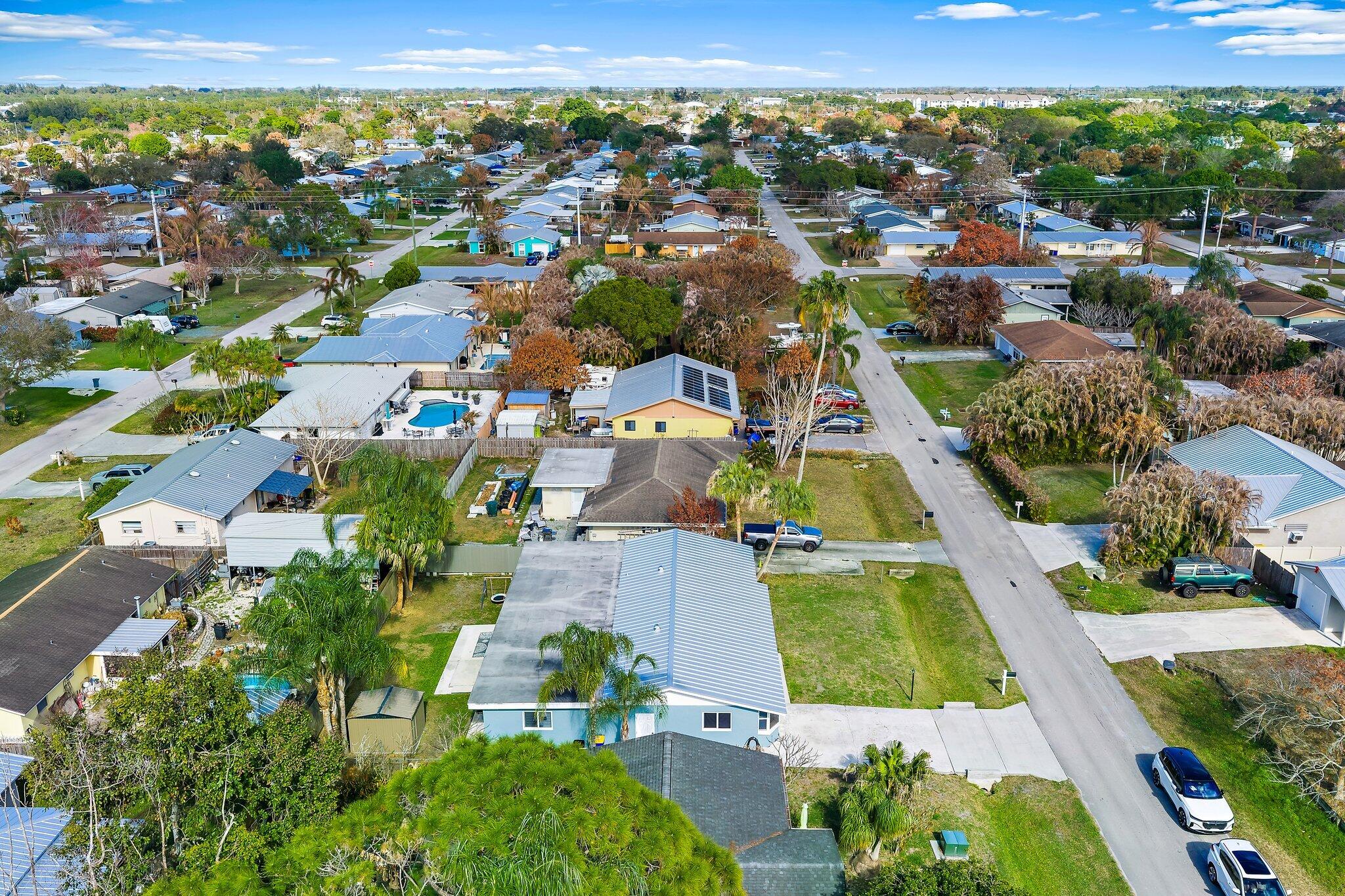 1851 Southeast Jackson Street Stuart, FL 34997 - Photo 60 of 61 an aerial view of residential houses with outdoor space