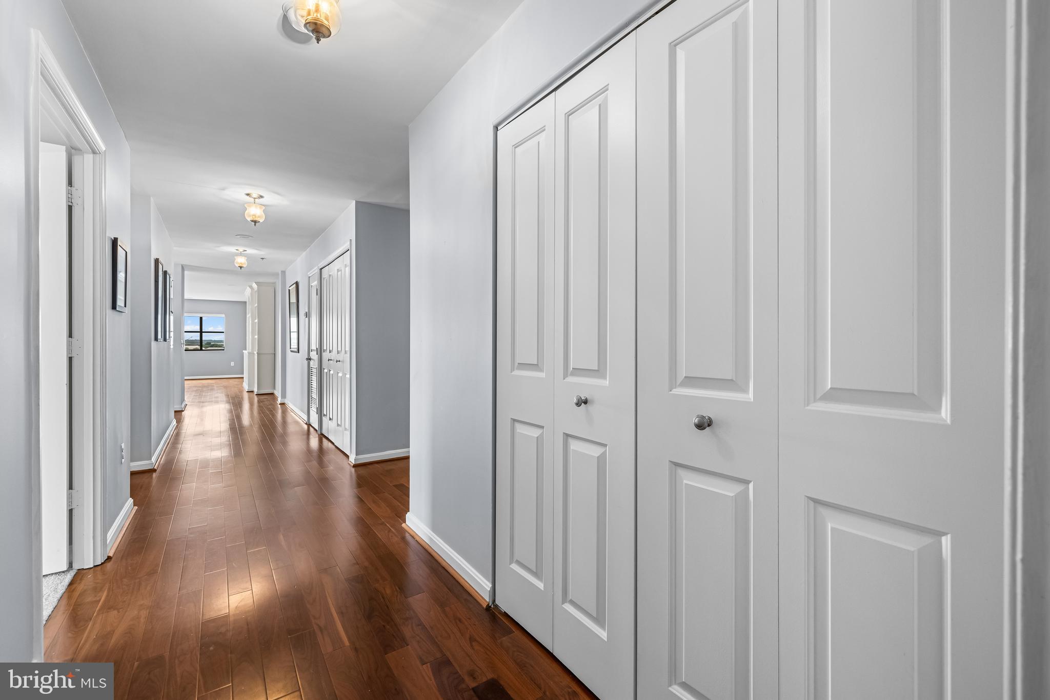 2702 Lighthouse Point East, Unit 638 Baltimore, MD 21224 - Photo 11 of 72 a view of a hallway with wooden floor