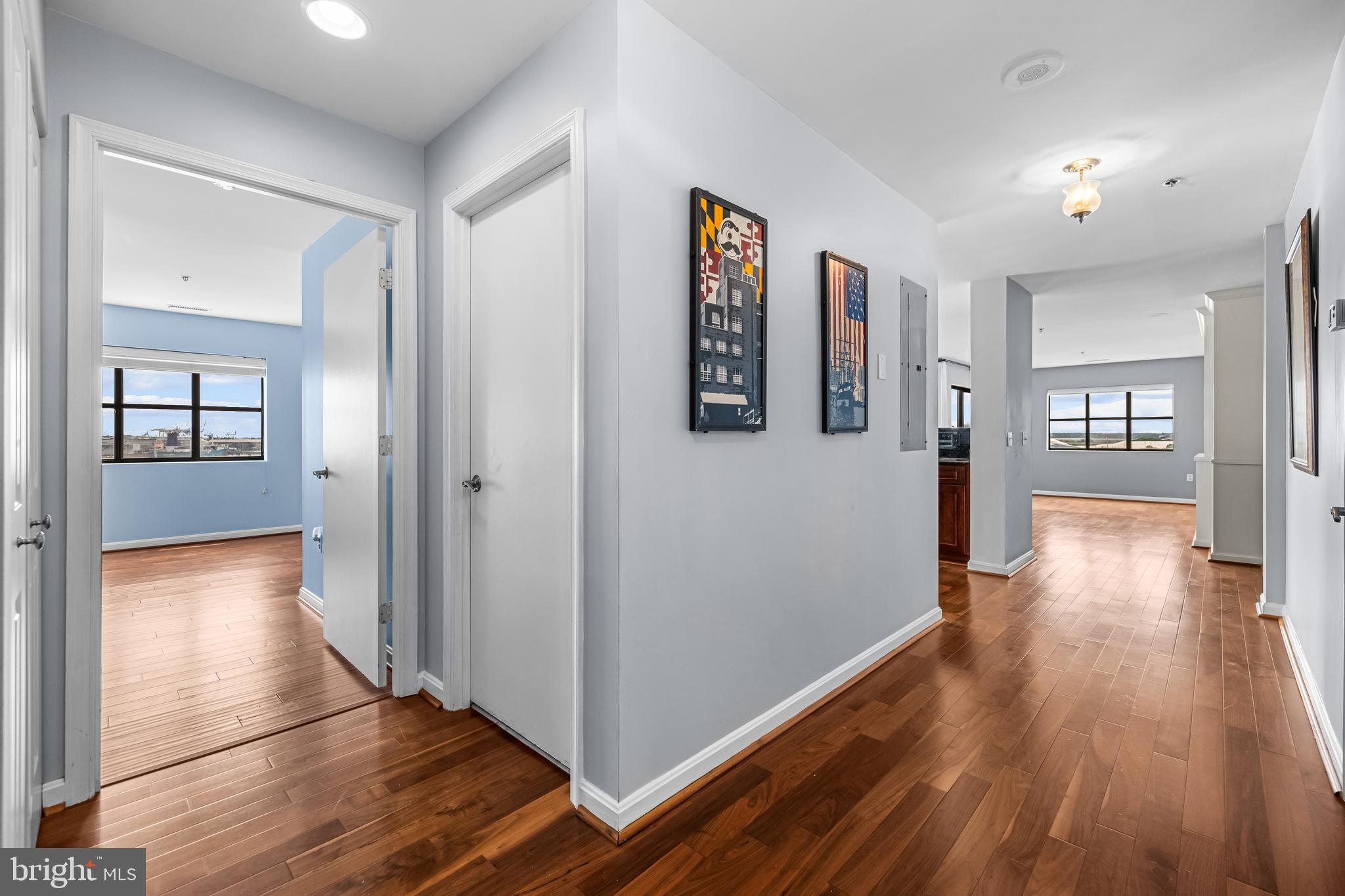 2702 Lighthouse Point East, Unit 638 Baltimore, MD 21224 - Photo 13 of 72 a view of a hallway with wooden floor and furniture