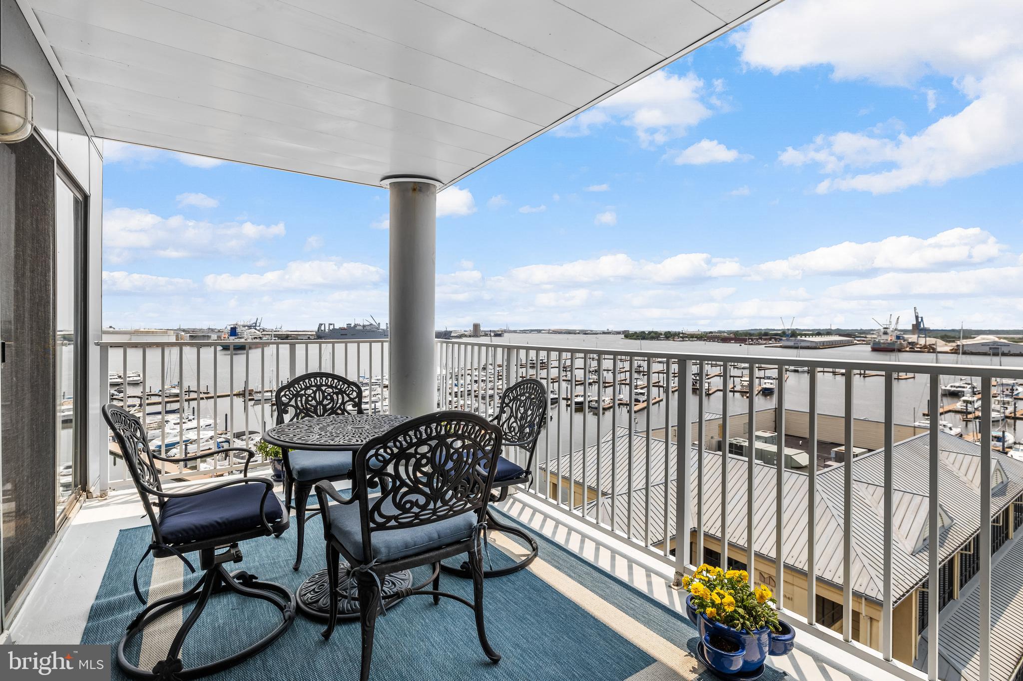 2702 Lighthouse Point East, Unit 638 Baltimore, MD 21224 - Photo 2 of 72 a view of a balcony with furniture