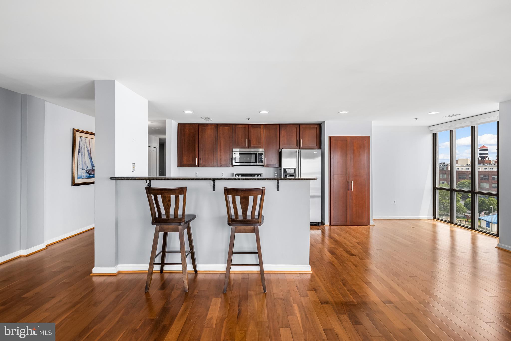 2702 Lighthouse Point East, Unit 638 Baltimore, MD 21224 - Photo 25 of 72 a view of kitchen with furniture and wooden floor