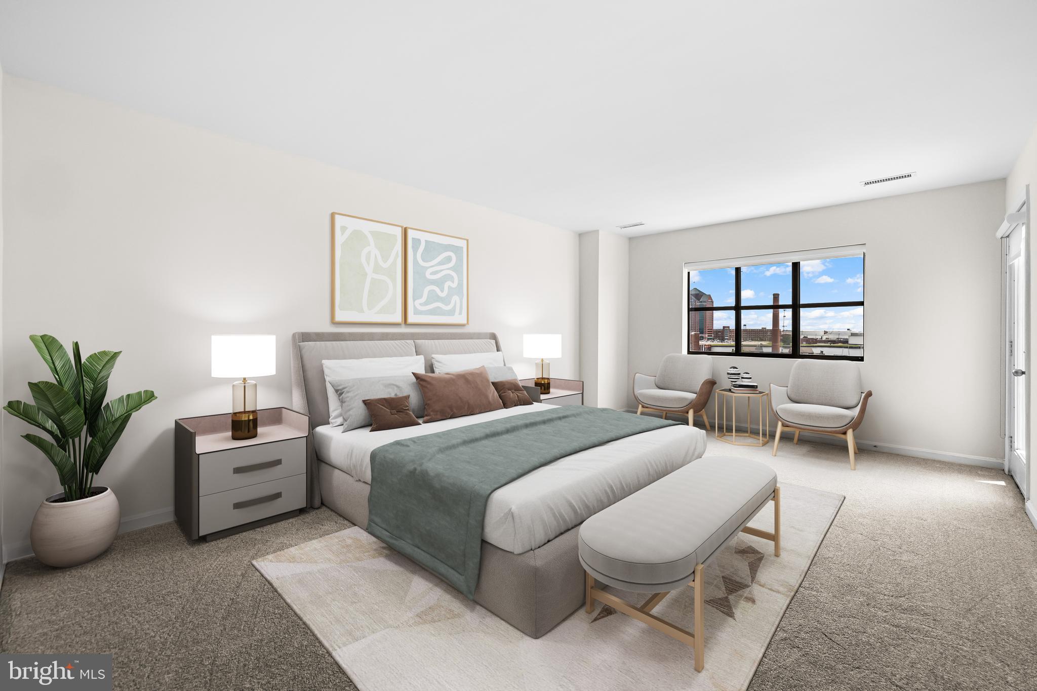 2702 Lighthouse Point East, Unit 638 Baltimore, MD 21224 - Photo 32 of 72 a bedroom with a large bed and a window