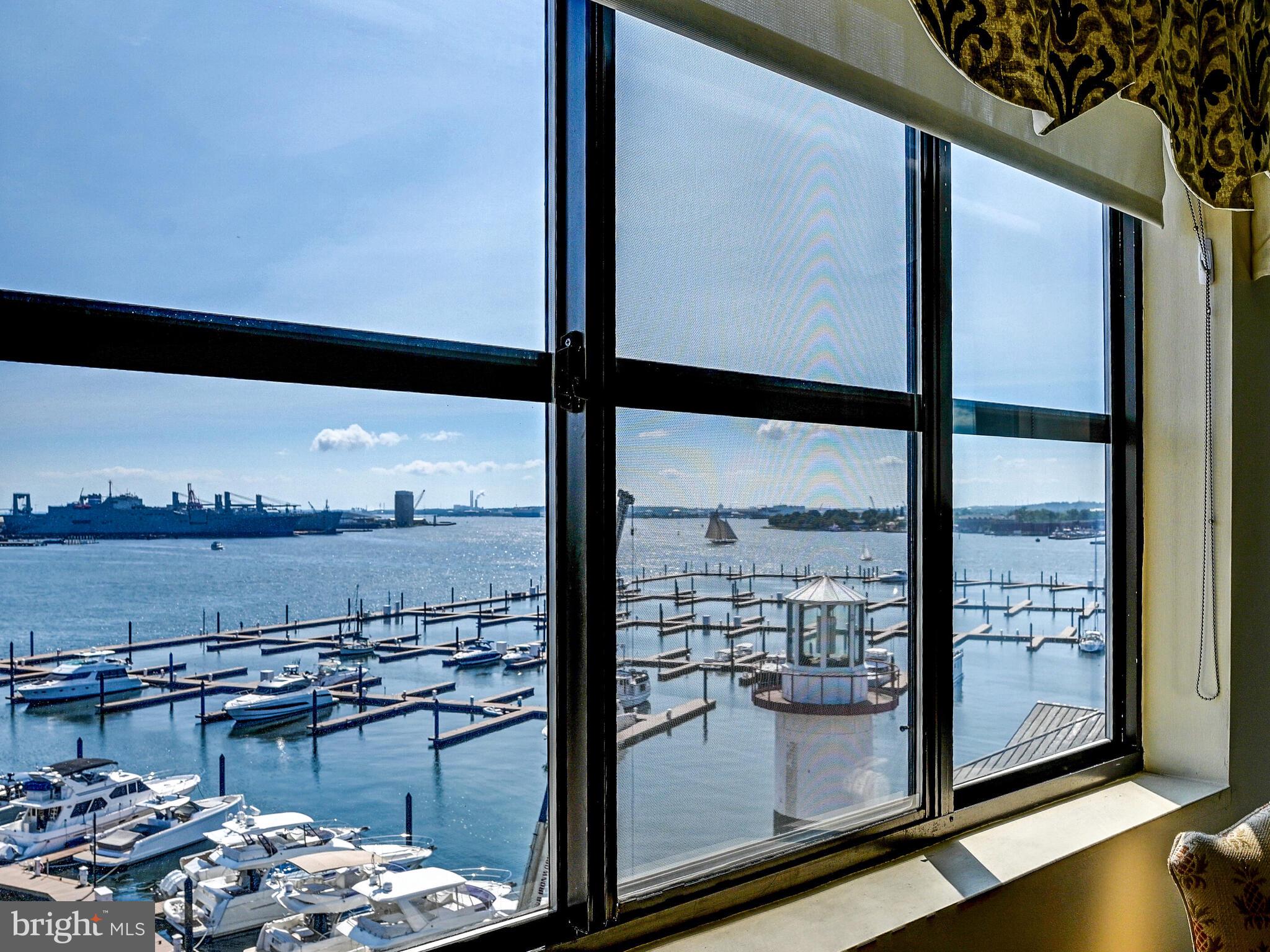2702 Lighthouse Point East, Unit 638 Baltimore, MD 21224 - Photo 33 of 72 a view of a lake from a window