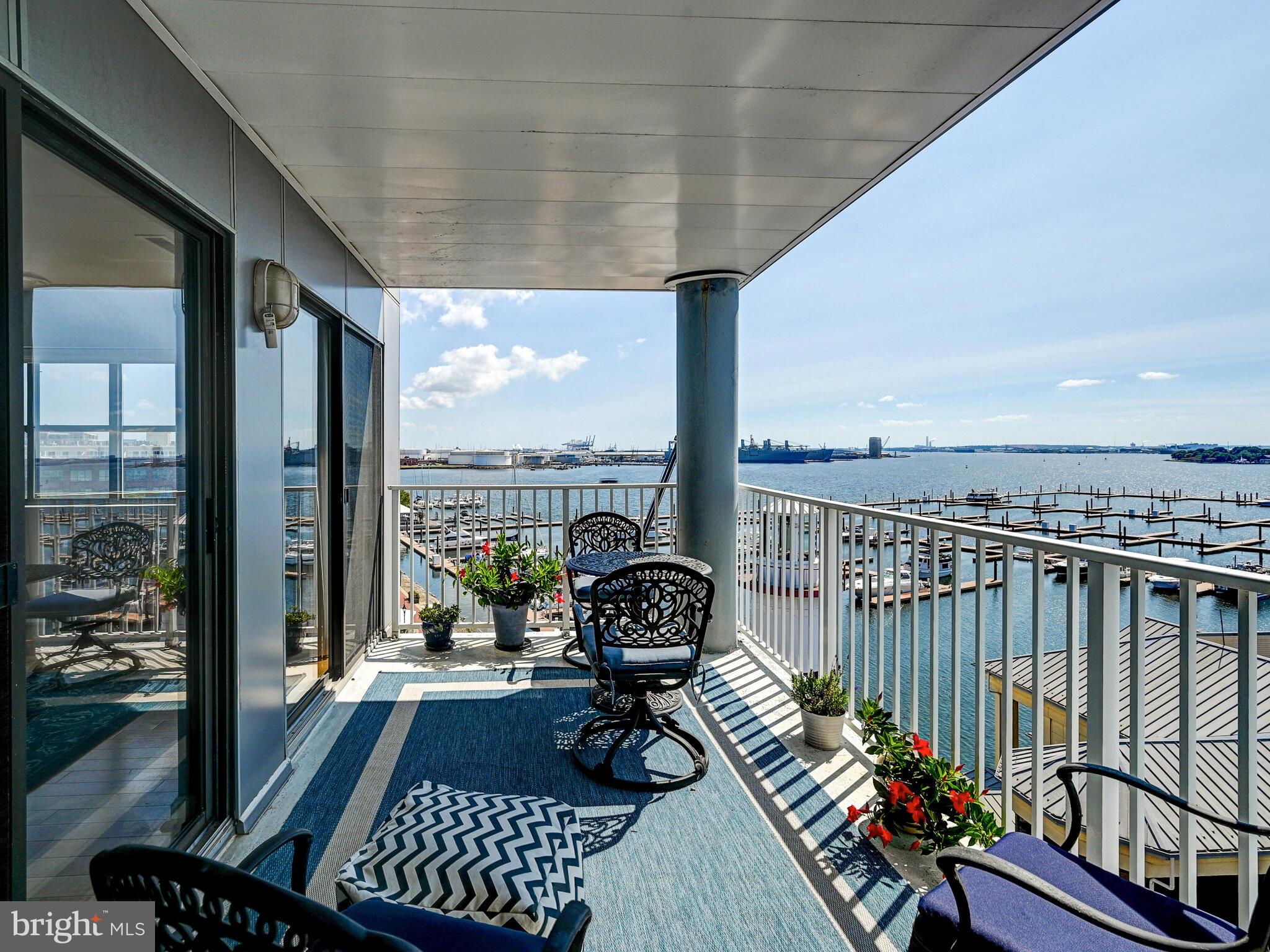 2702 Lighthouse Point East, Unit 638 Baltimore, MD 21224 - Photo 45 of 72 a view of a balcony with wooden floor
