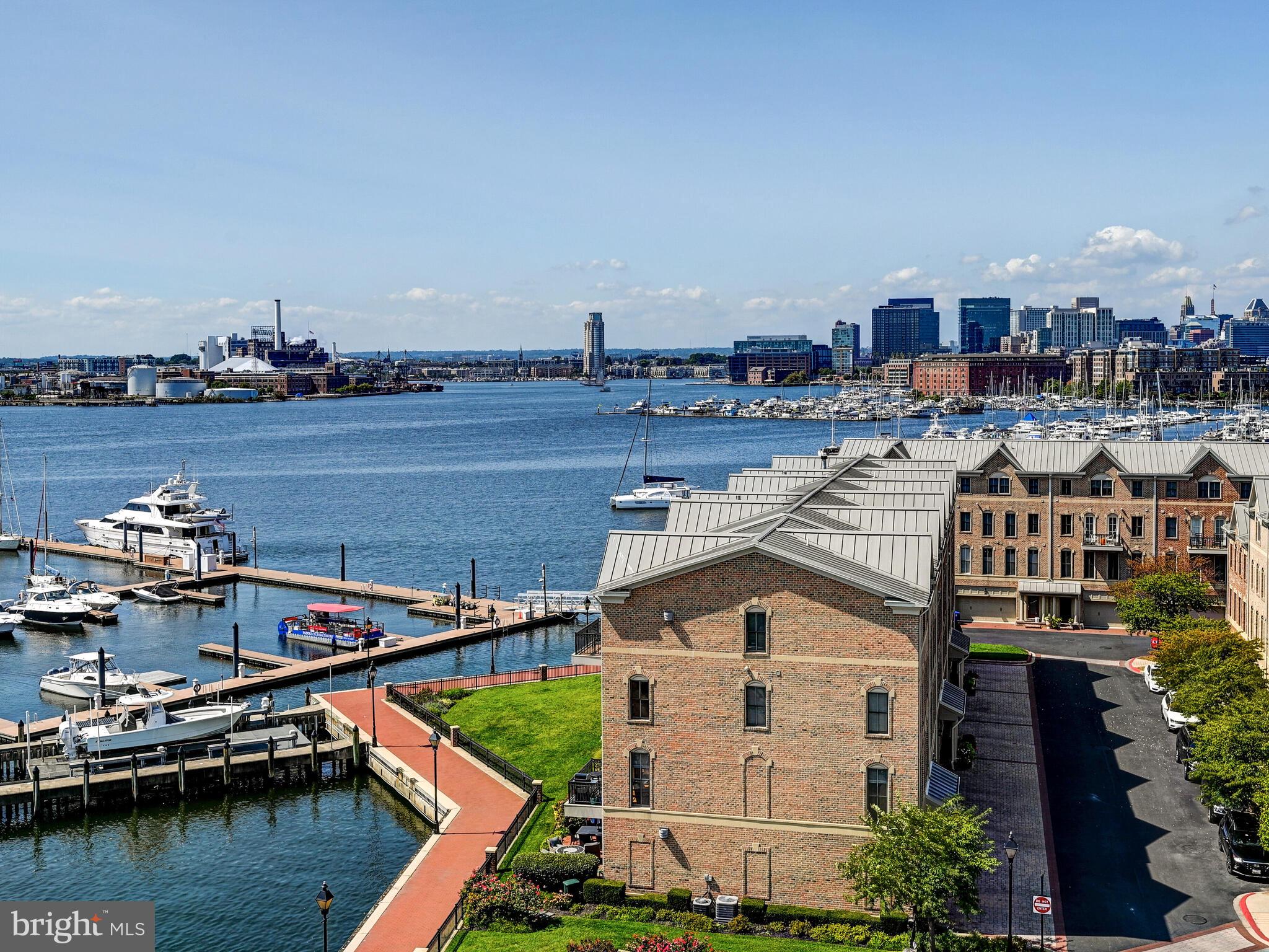 2702 Lighthouse Point East, Unit 638 Baltimore, MD 21224 - Photo 55 of 72 a view of a lake with tall buildings