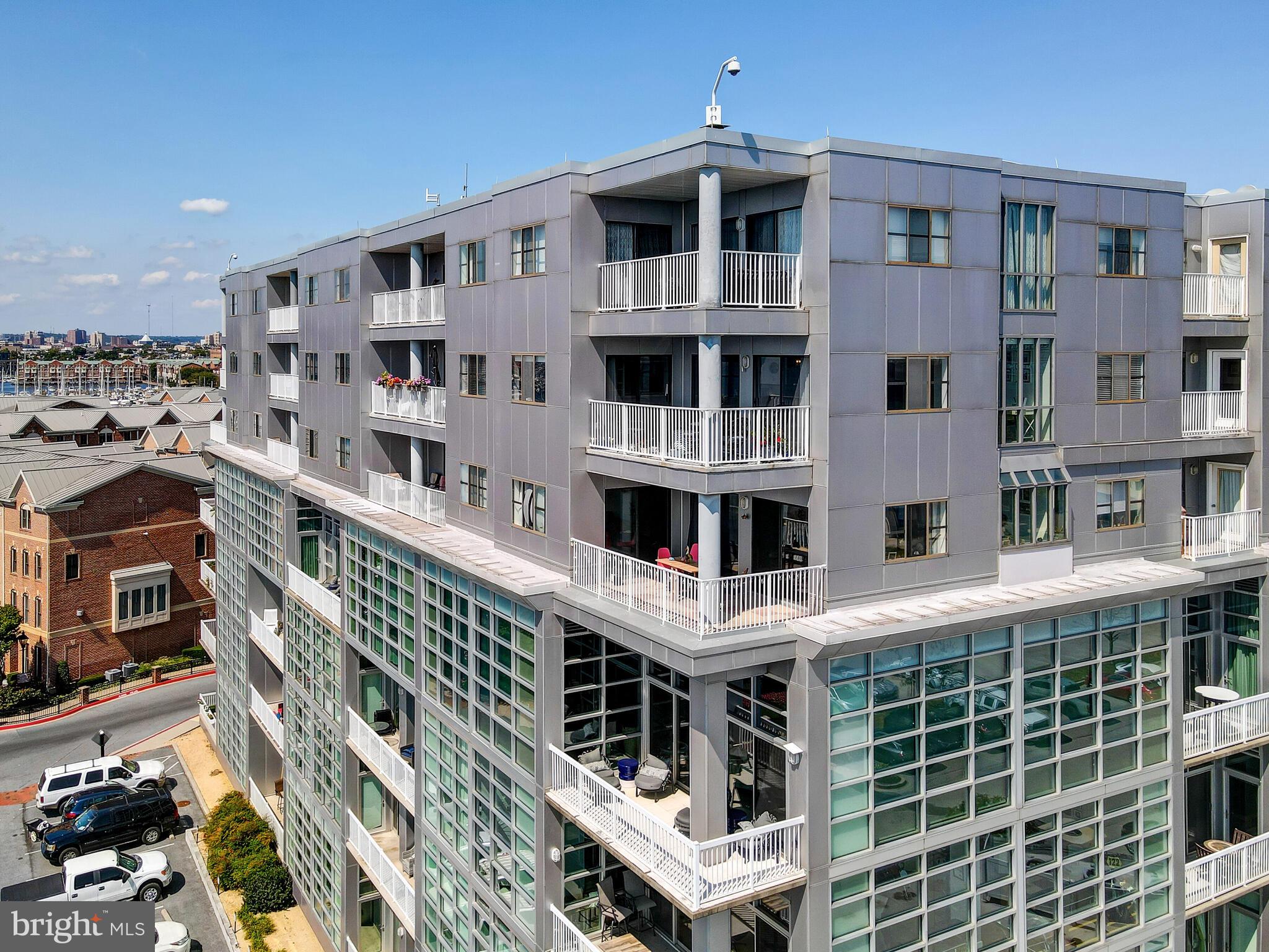 2702 Lighthouse Point East, Unit 638 Baltimore, MD 21224 - Photo 69 of 72 a large building with a lot of windows