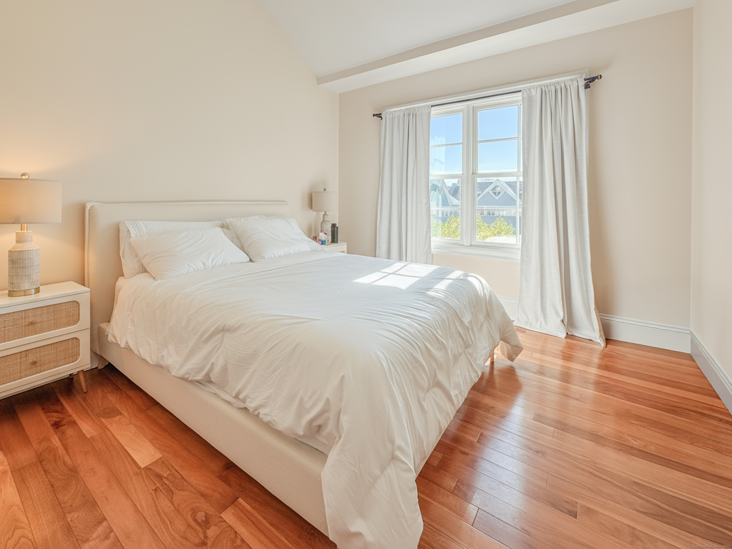 130 Post Road West, Unit PH Westport, CT 06880 - Photo 11 of 21 a large bed sitting in a bedroom next to a window