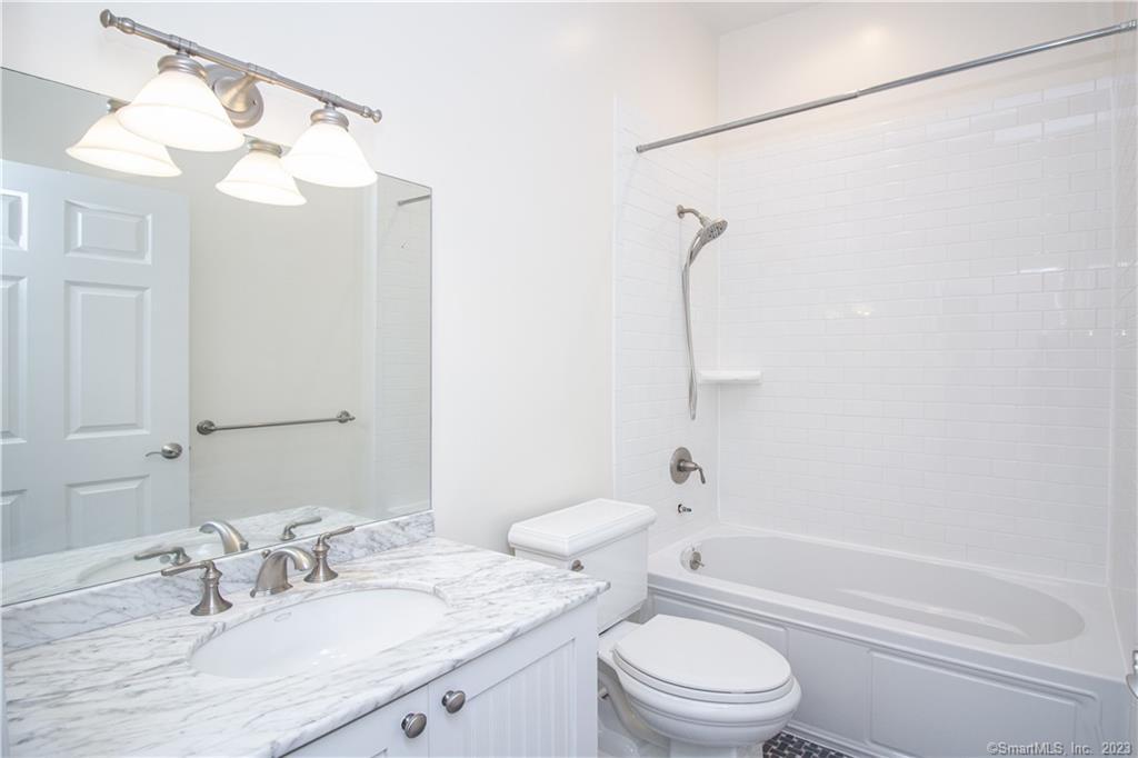 130 Post Road West, Unit PH Westport, CT 06880 - Photo 13 of 21 a bathroom with a granite countertop sink a toilet and shower