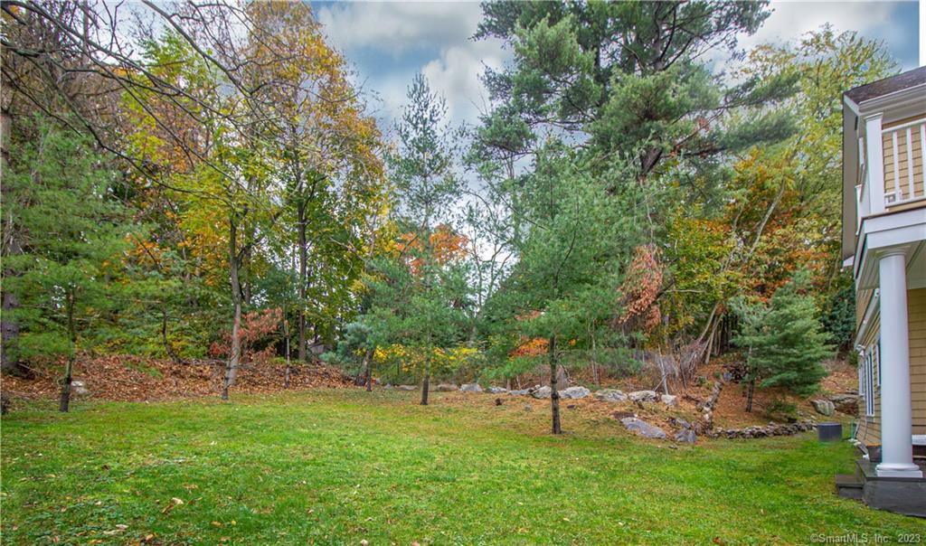 130 Post Road West, Unit PH Westport, CT 06880 - Photo 15 of 21 a view of a backyard with a garden
