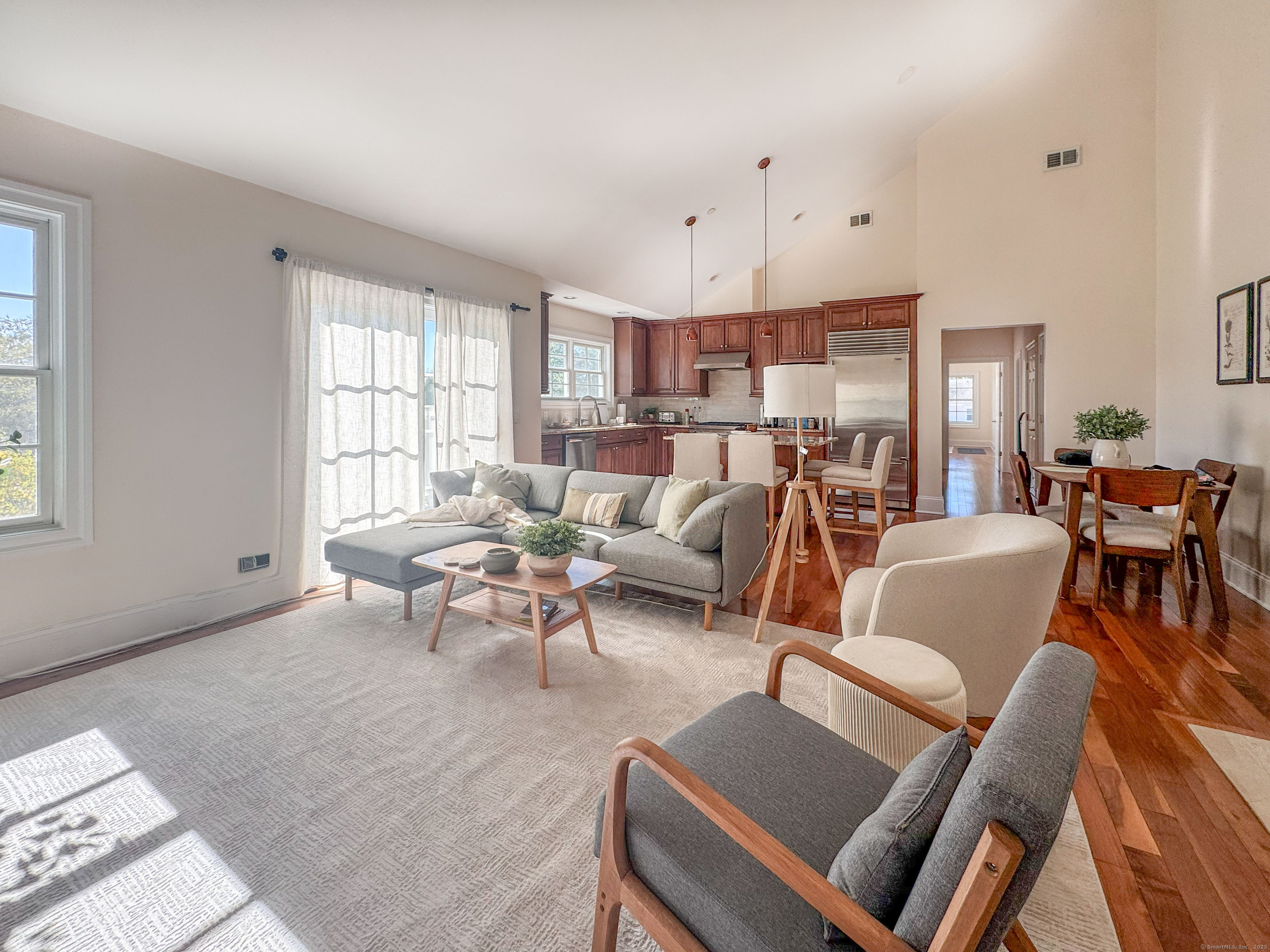 130 Post Road West, Unit PH Westport, CT 06880 - Photo 4 of 21 a living room with furniture and a large window