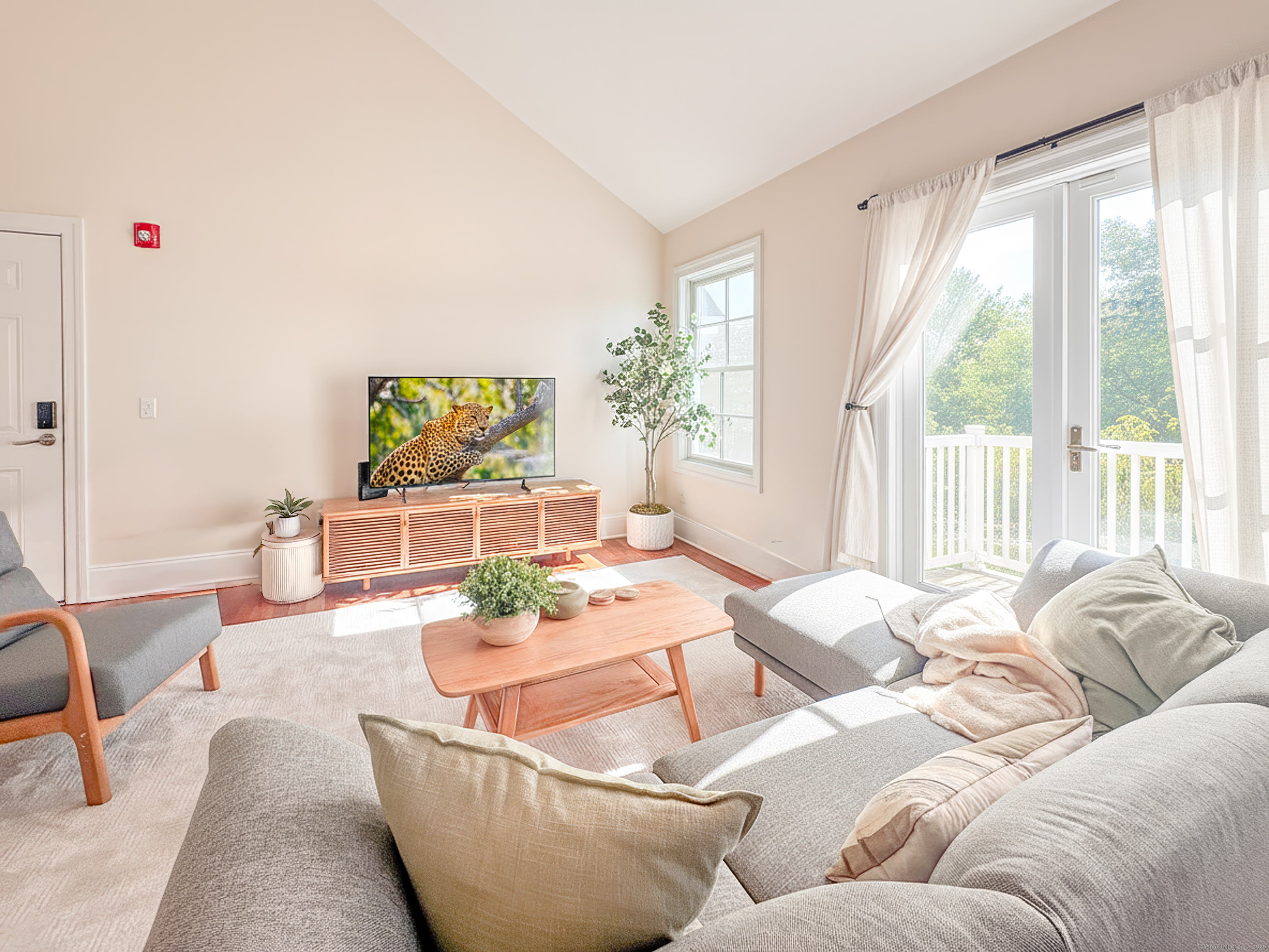 130 Post Road West, Unit PH Westport, CT 06880 - Photo 5 of 21 a living room with furniture and a large window