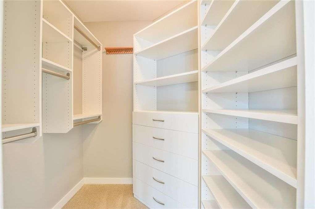 250 Pharr Road Northeast, Unit 2002 Atlanta, GA 30305 - Photo 3 of 13 a view of walk in closet with empty racks