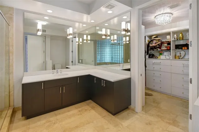 a bathroom with a sink vanity and a mirror