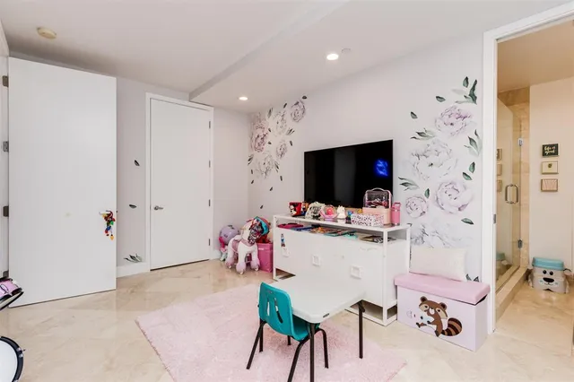 a view of a livingroom with furniture and a flat screen tv