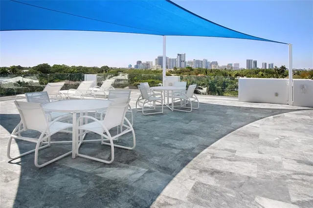 a view of a chairs and table in the patio