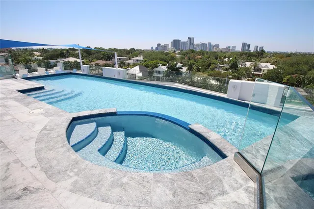 a view of a swimming pool with a terrace