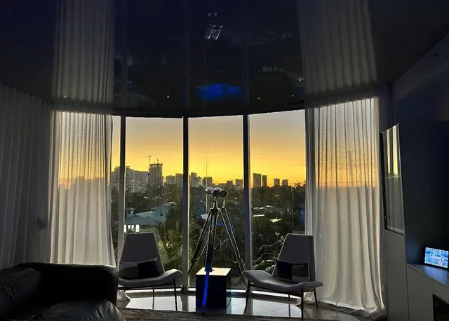 a living room with large windows