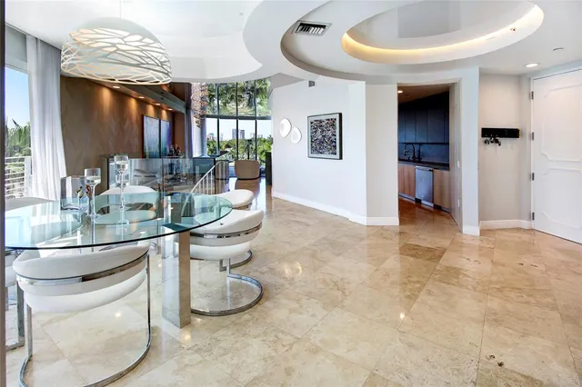 a dining room with furniture a window and kitchen view