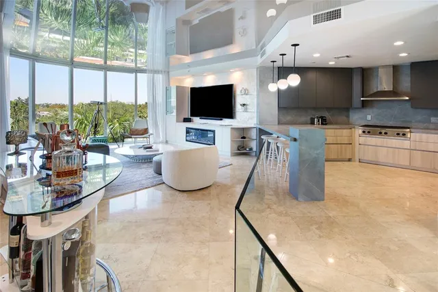 a living room with a flat screen tv and a fireplace